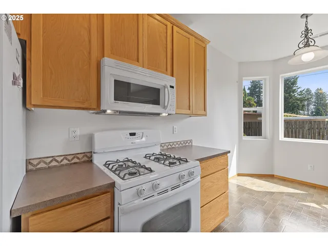 a kitchen with a stove and a microwave