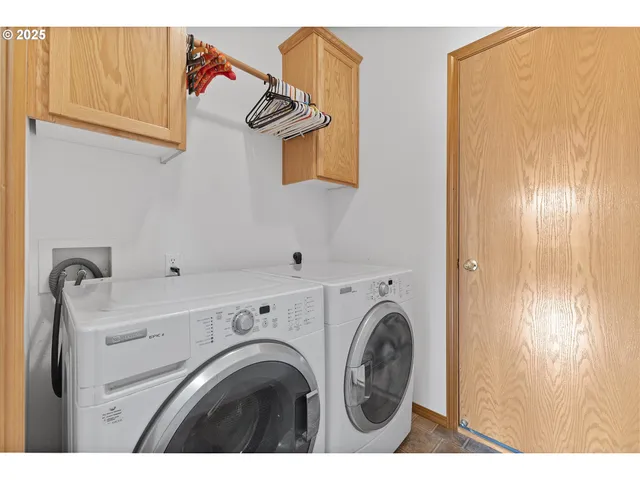 a view of livingroom with washer and dryer