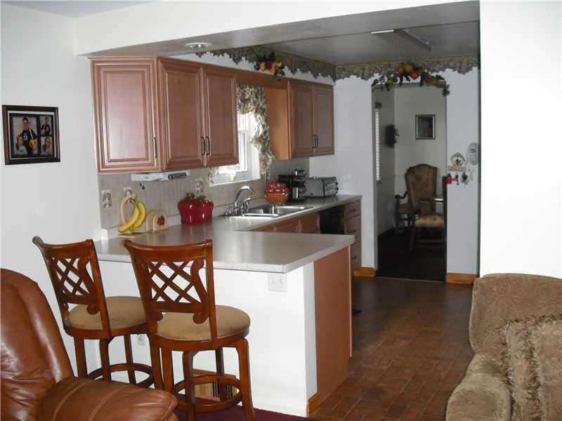 2483 Rose Garden Road Pittsburgh, PA 15220 - Photo 8 of 25 Kitchen. Alternate view of kitchen showing the breakfast bar area as viewed from the first floor family room.