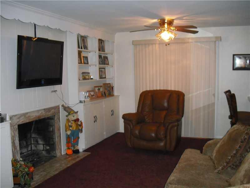2483 Rose Garden Road Pittsburgh, PA 15220 - Photo 10 of 25 Family Room. View of first floor family room with log burning fireplace conveniently located off the kitchen.