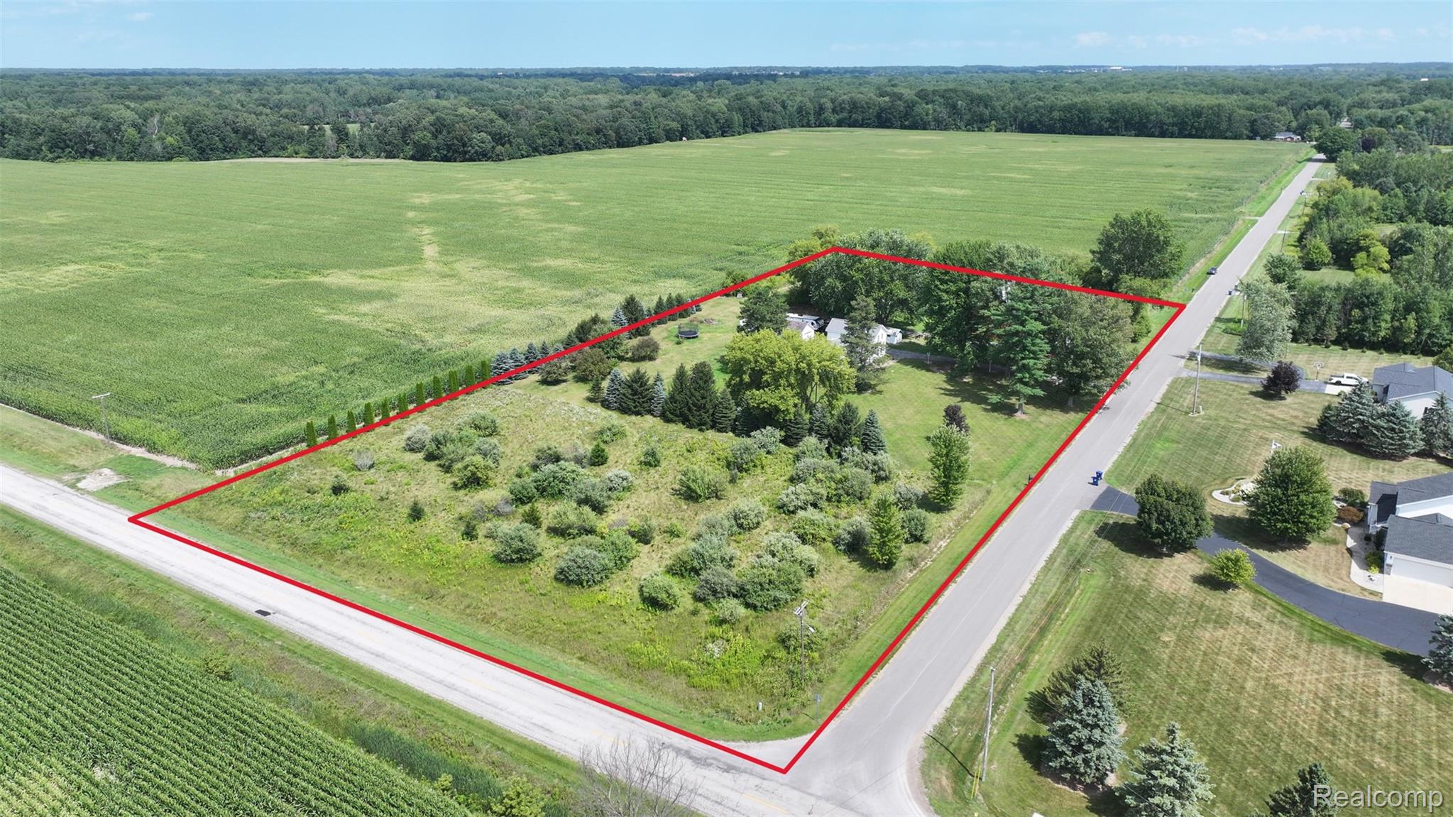 12930 Wilkinson Road Freeland, MI 48623 - Photo 38 of 76 Expansive property featuring a treed lot, established landscaping, and direct road frontage