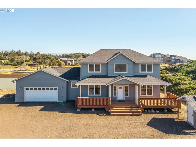 a view of a house with a garden and balcony