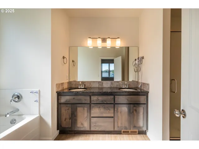 a bathroom with a granite countertop sink a mirror and a