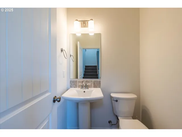 a bathroom with a sink and mirror