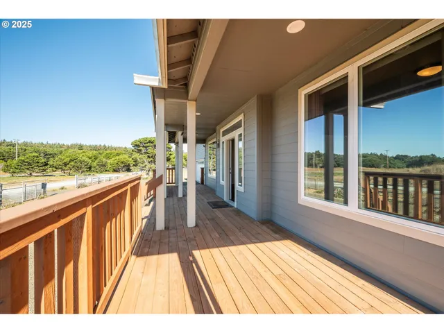 a view of balcony with wooden floor