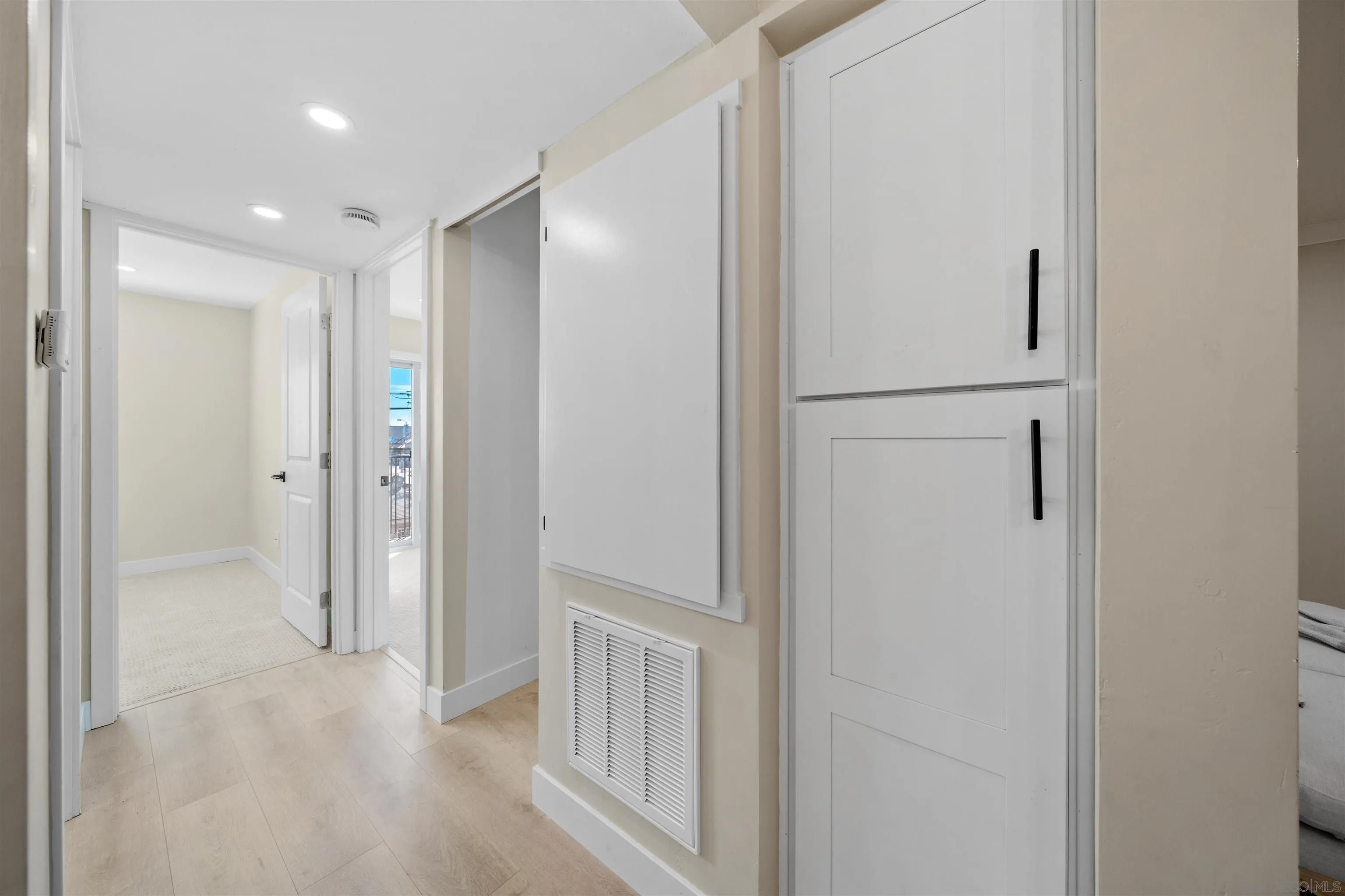 4521 55th Street, Unit 13 San Diego, CA 92115 - Photo 11 of 26 a view of a hallway with wooden floor