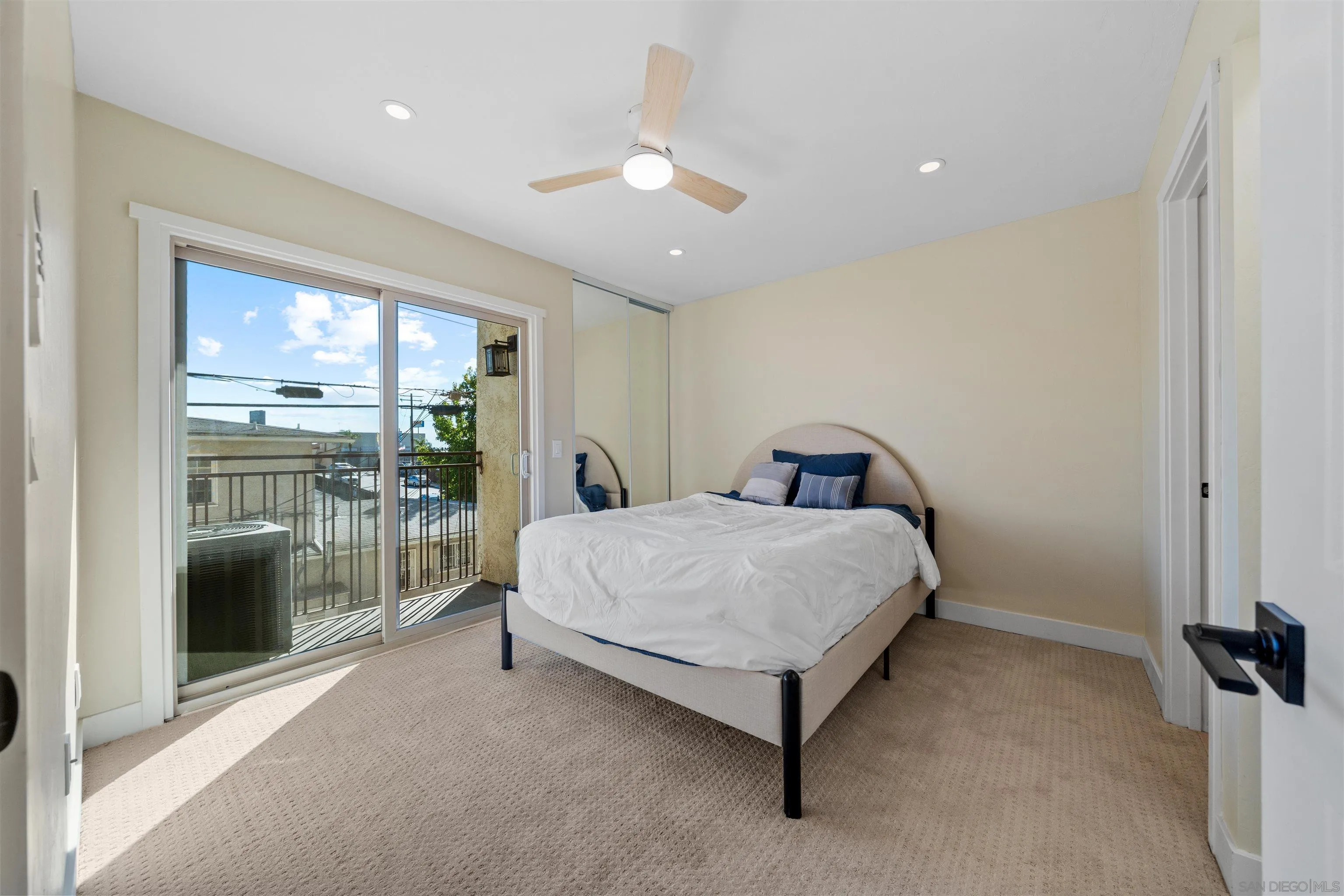 4521 55th Street, Unit 13 San Diego, CA 92115 - Photo 13 of 26 a bedroom with a bed and a large window
