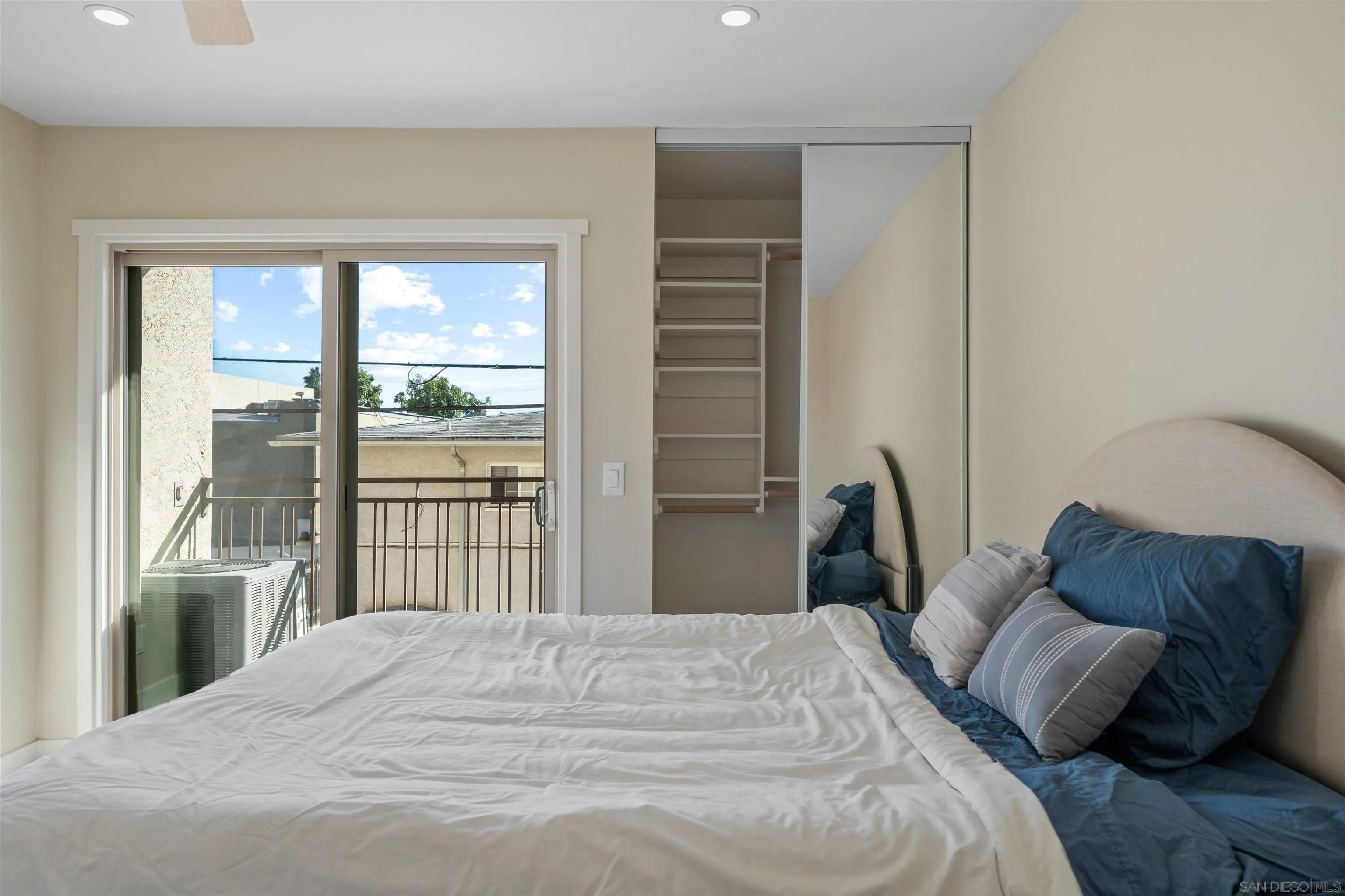 4521 55th Street, Unit 13 San Diego, CA 92115 - Photo 16 of 26 a bedroom with a bed and a window