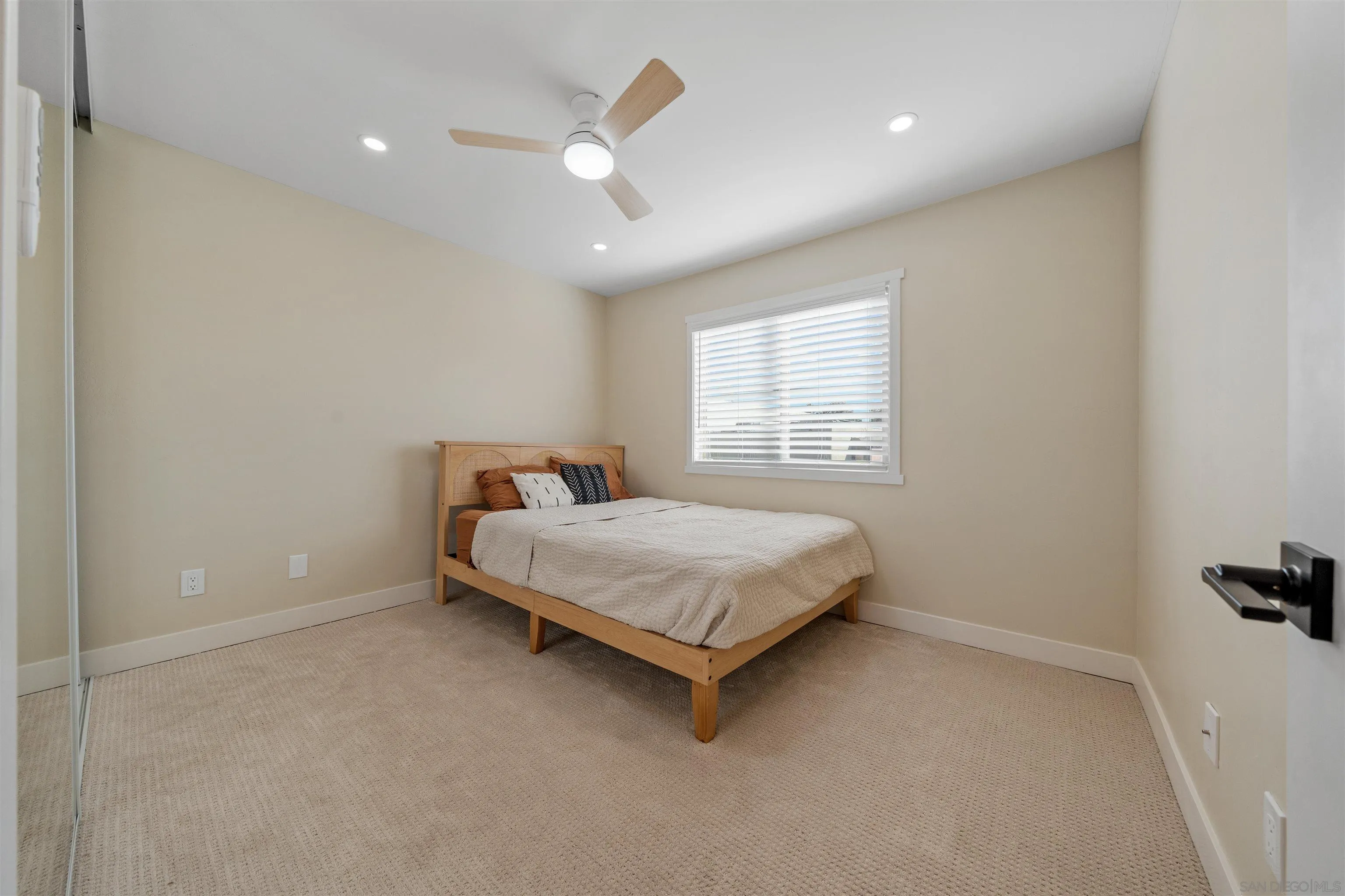 4521 55th Street, Unit 13 San Diego, CA 92115 - Photo 19 of 26 a bedroom with a bed and a window