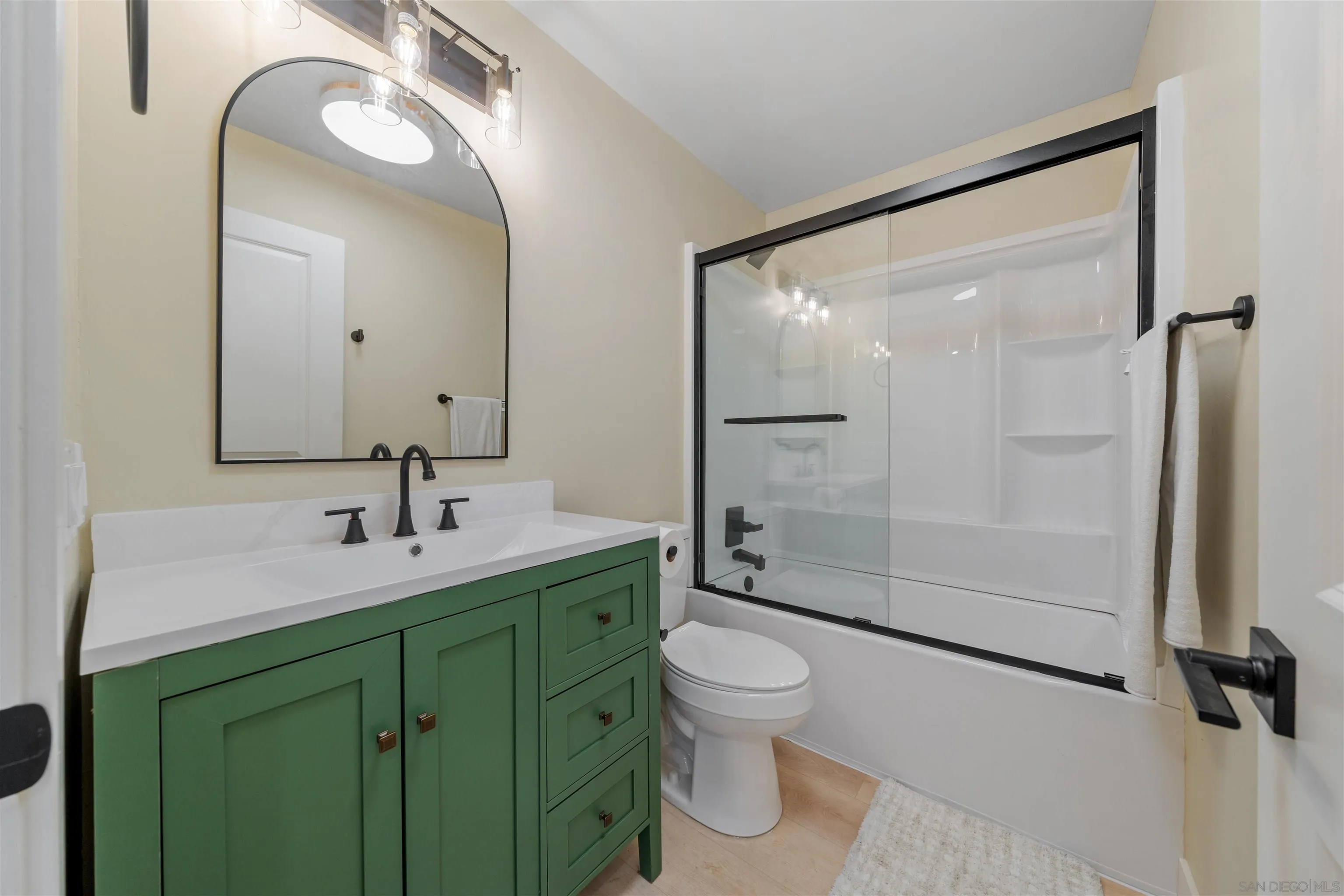 4521 55th Street, Unit 13 San Diego, CA 92115 - Photo 21 of 26 a bathroom with a toilet sink and mirror