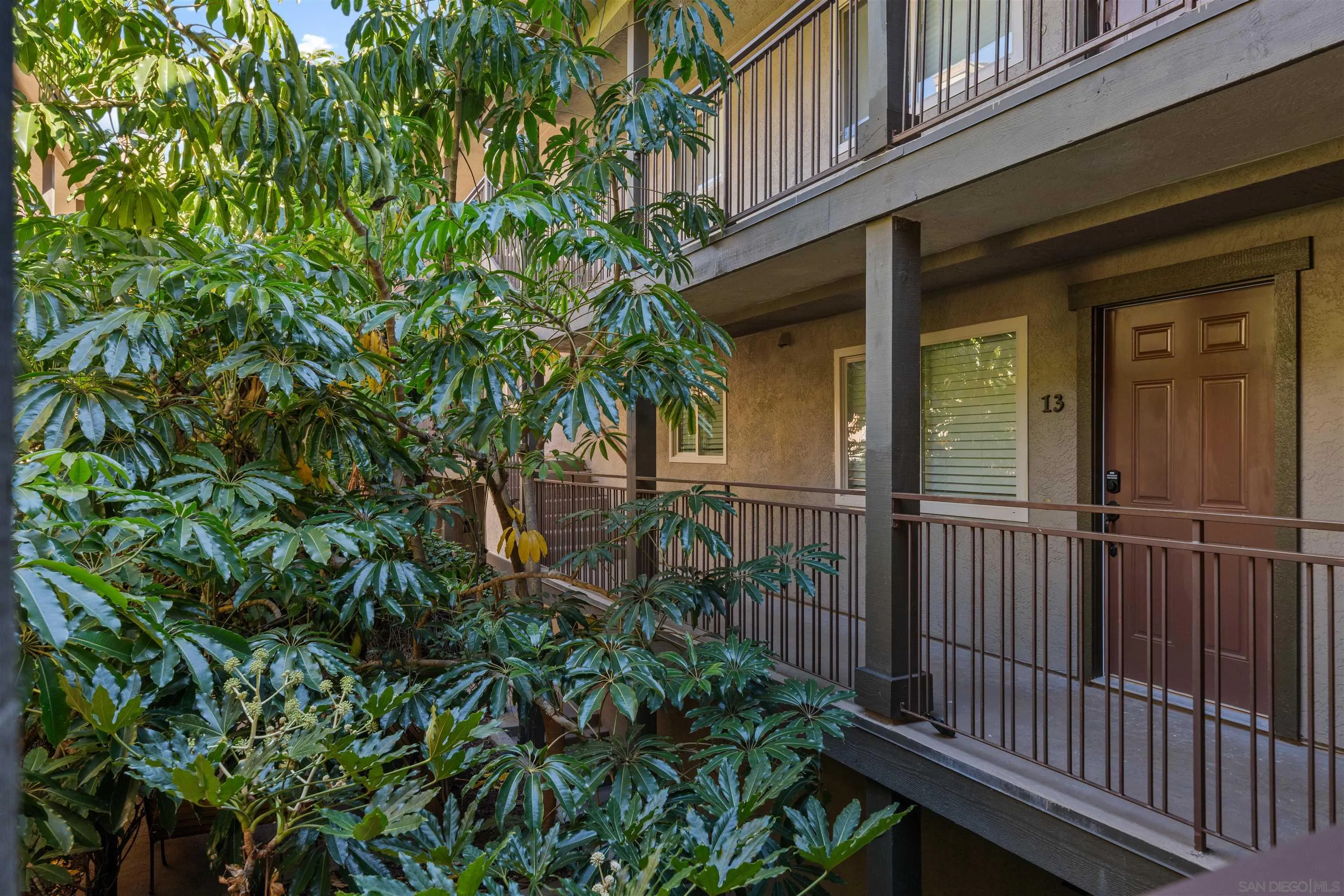 4521 55th Street, Unit 13 San Diego, CA 92115 - Photo 23 of 26 a view of a house with a small yard