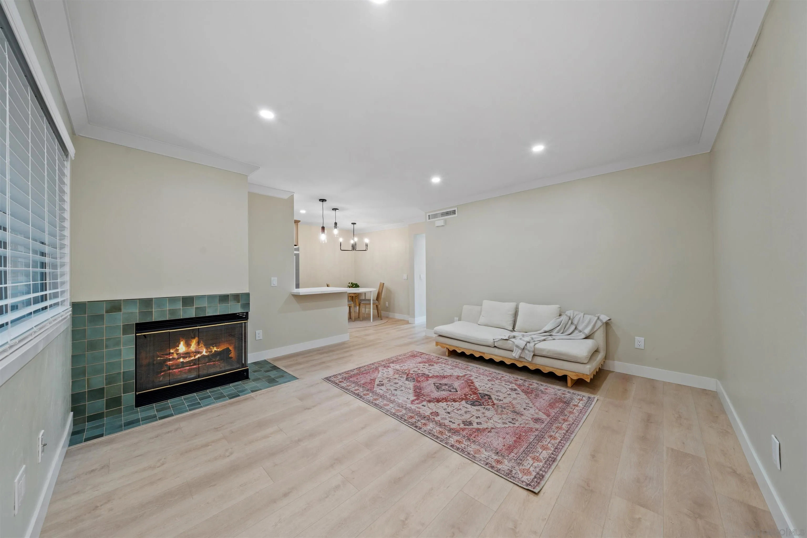 4521 55th Street, Unit 13 San Diego, CA 92115 - Photo 3 of 26 a living room with furniture and a fireplace