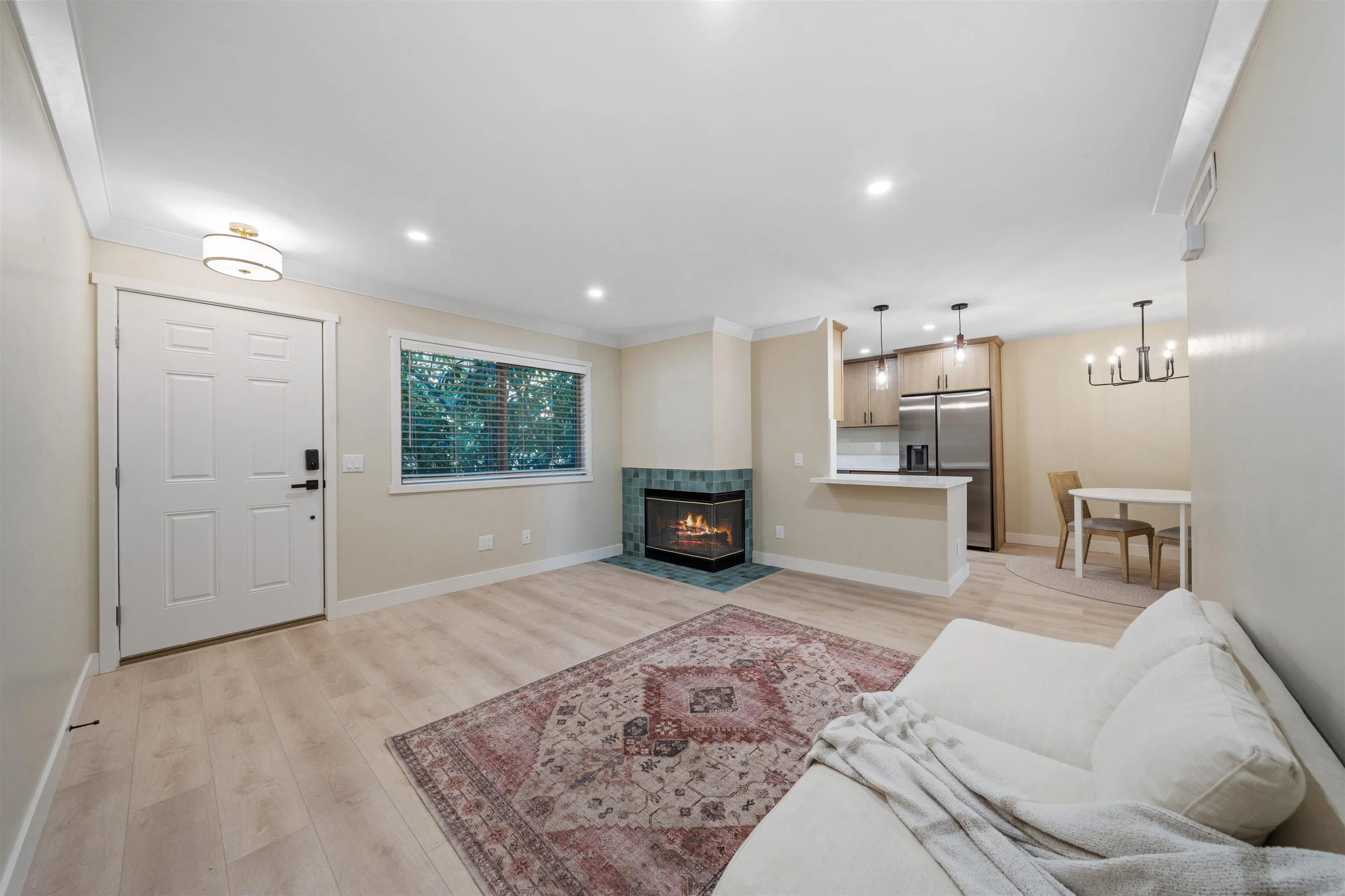 4521 55th Street, Unit 13 San Diego, CA 92115 - Photo 4 of 26 a living room with furniture and a fireplace