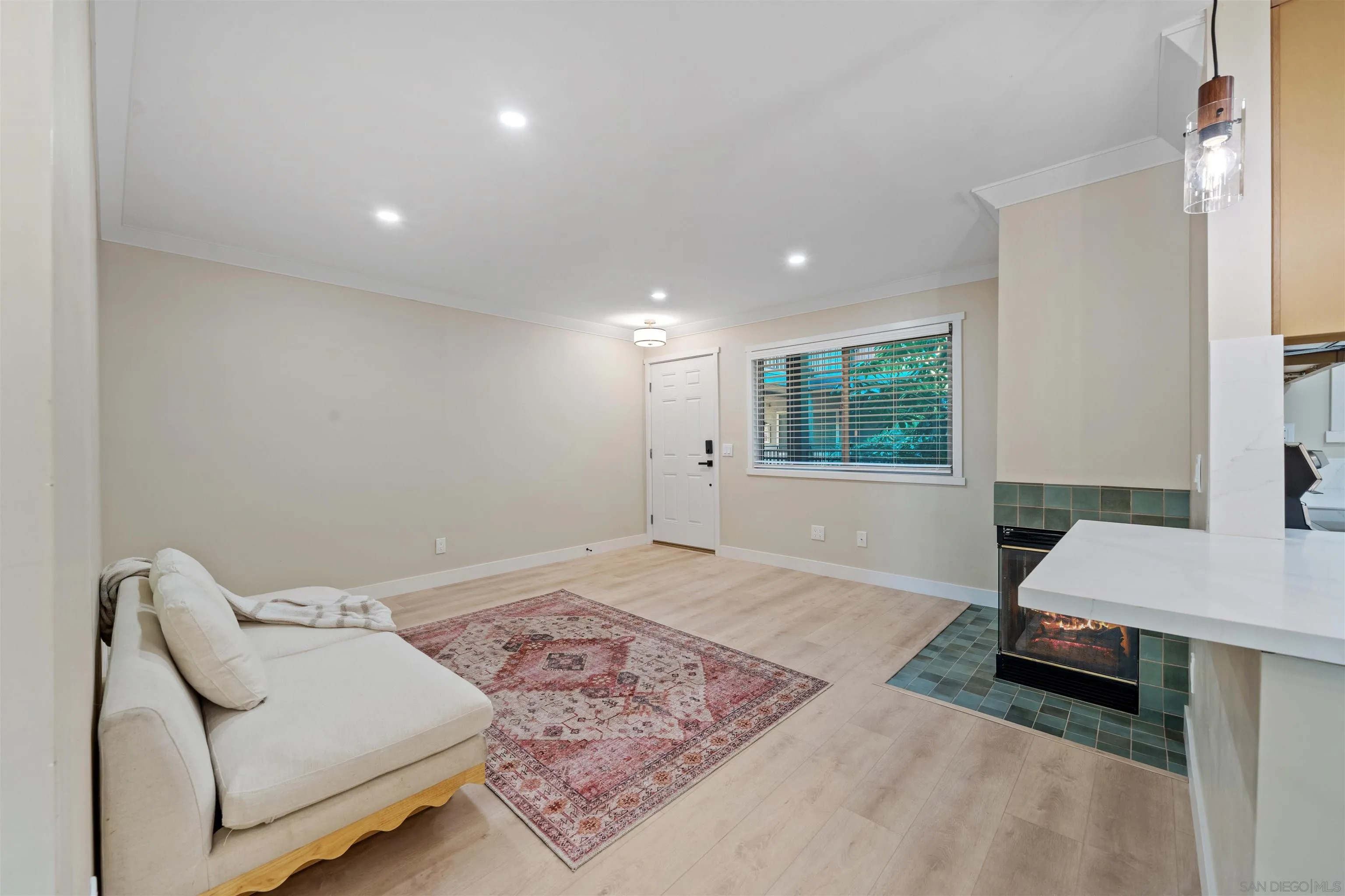 4521 55th Street, Unit 13 San Diego, CA 92115 - Photo 5 of 26 a spacious bedroom with a bed a couch and a window
