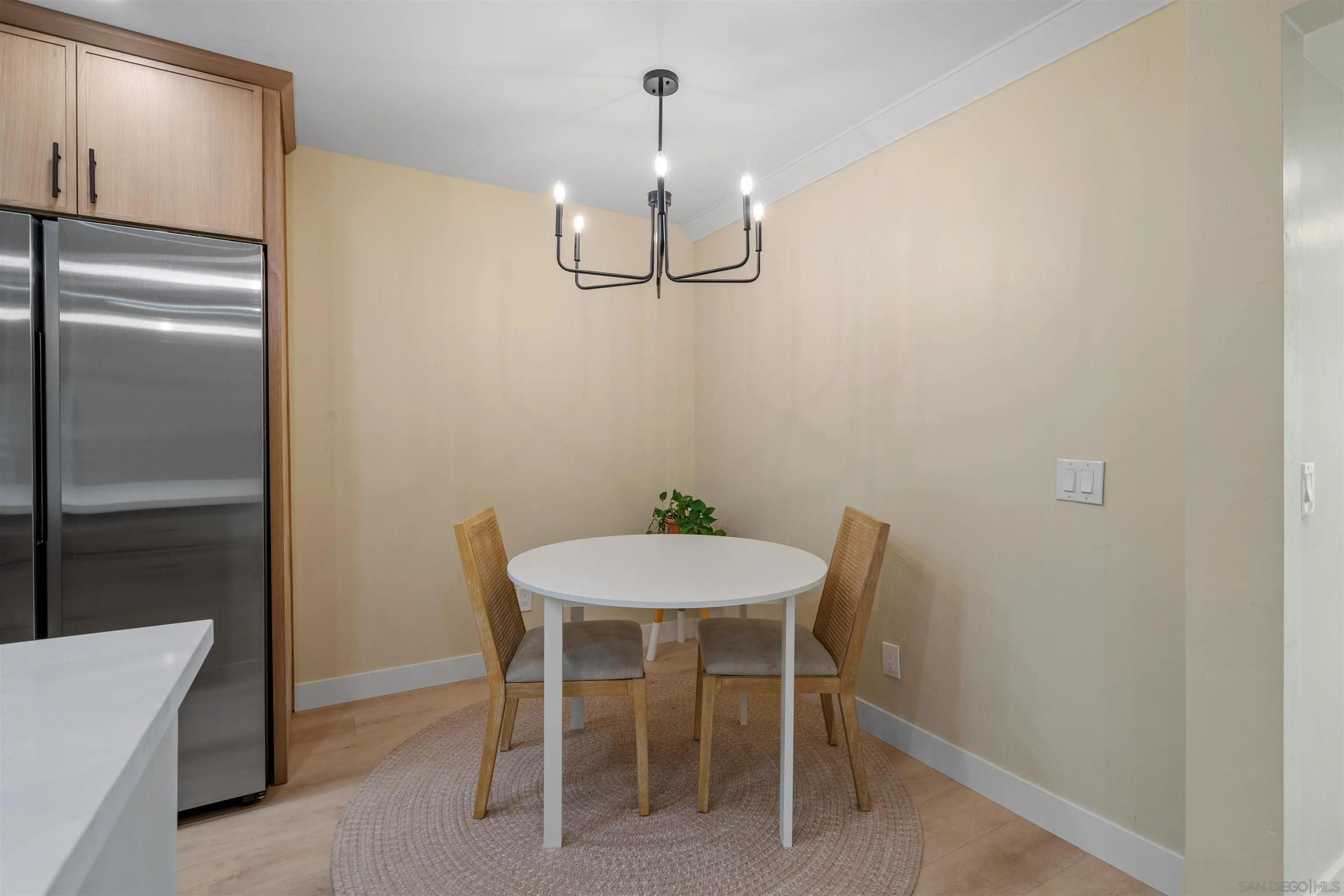4521 55th Street, Unit 13 San Diego, CA 92115 - Photo 7 of 26 a dining room with a table and chairs