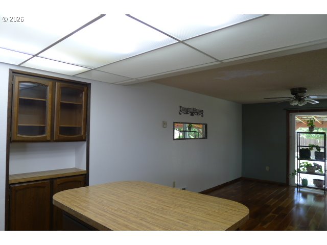 412 Camellia Court Reedsport, OR 97467 - Photo 25 of 48 a bedroom with a bed and wooden floor