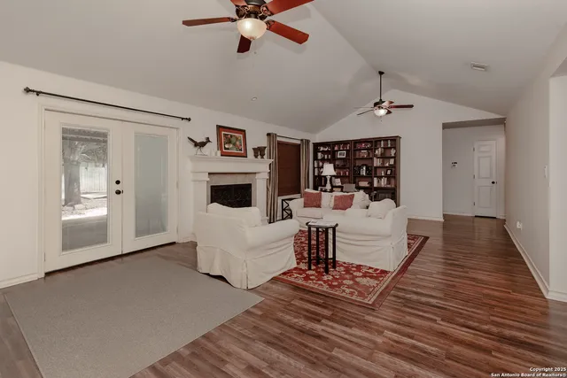 a living room with furniture and a fireplace