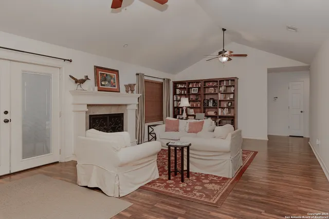 a living room with furniture and a fireplace