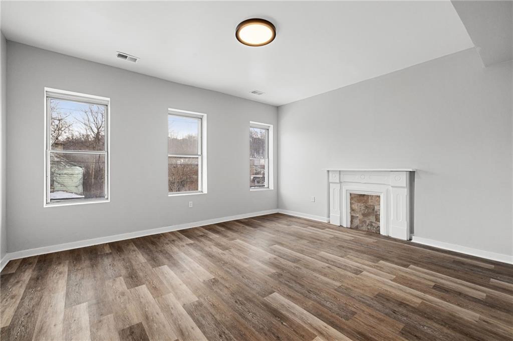 1319 Adams Street Pittsburgh, PA 15233 - Photo 18 of 27 a view of empty room with wooden floor and fan