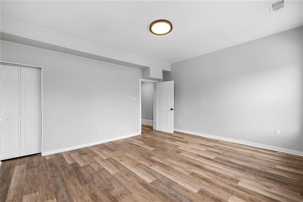 1319 Adams Street Pittsburgh, PA 15233 - Photo 20 of 27 a view of an empty room with wooden floor