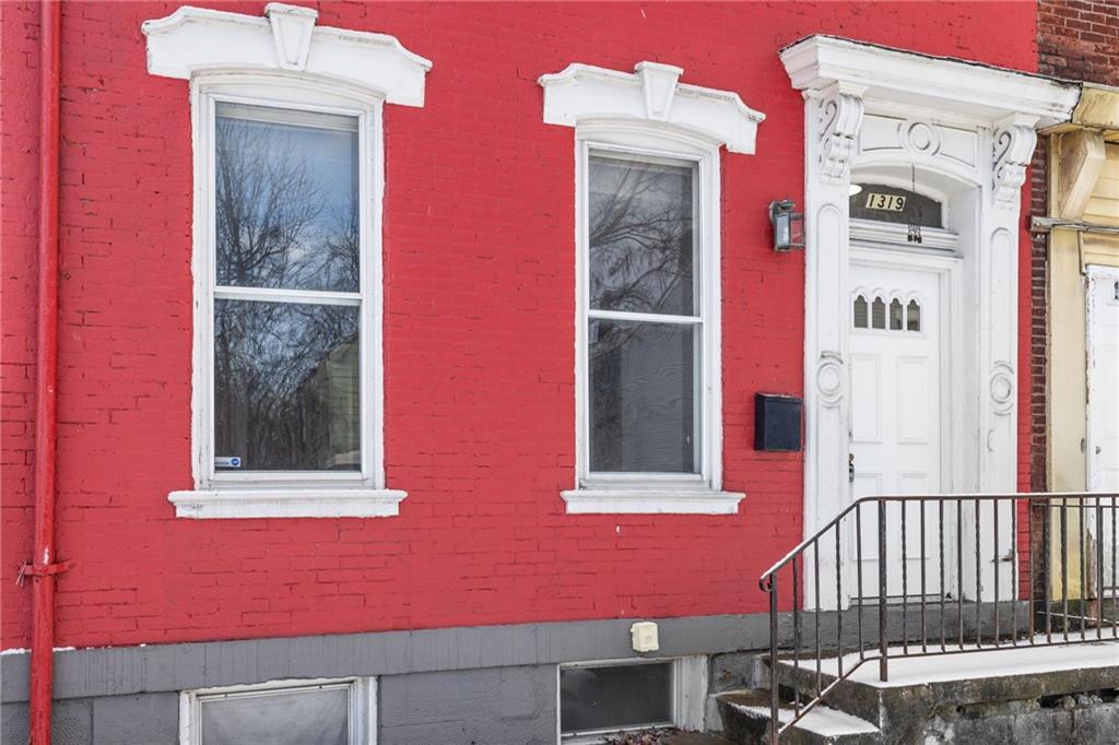 1319 Adams Street Pittsburgh, PA 15233 - Photo 4 of 27 a view of a house with a door and a window