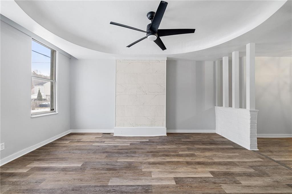 1319 Adams Street Pittsburgh, PA 15233 - Photo 6 of 27 a view of empty room with wooden floor and fan