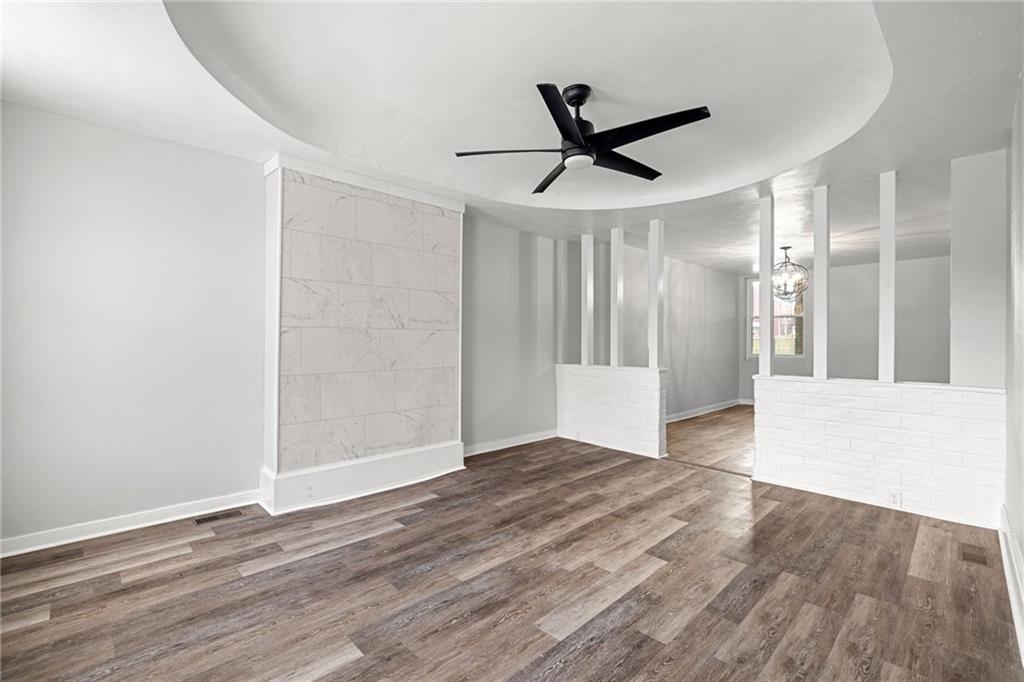 1319 Adams Street Pittsburgh, PA 15233 - Photo 7 of 27 a view of empty room with wooden floor and fan