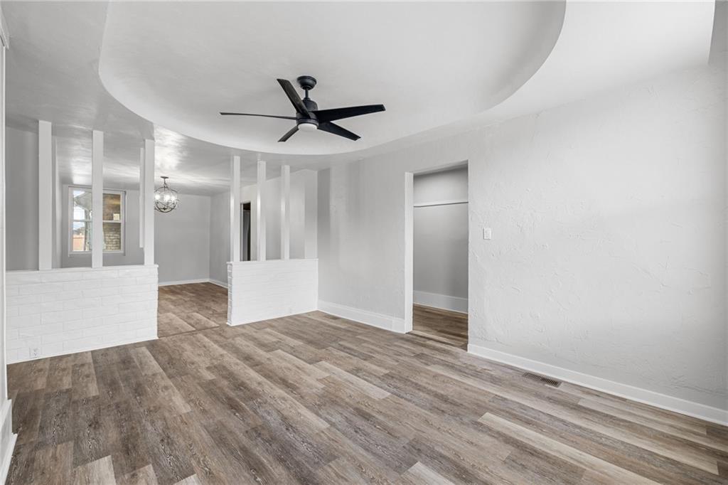 1319 Adams Street Pittsburgh, PA 15233 - Photo 8 of 27 a view of a livingroom with a ceiling fan & entryway