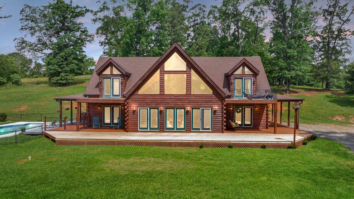 a front view of a house with a yard table and chairs