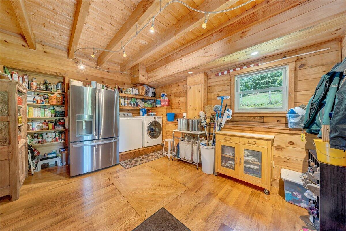 1769 Scenic View Road Moneta, VA 24121 - Photo 19 of 104 a view of a kitchen with stainless steel appliances wooden floor and furniture