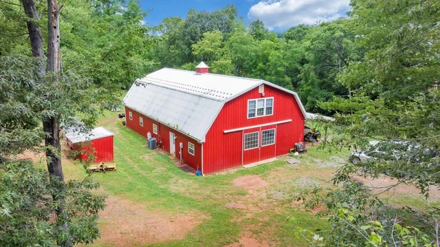 a front view of a house with porch and yard