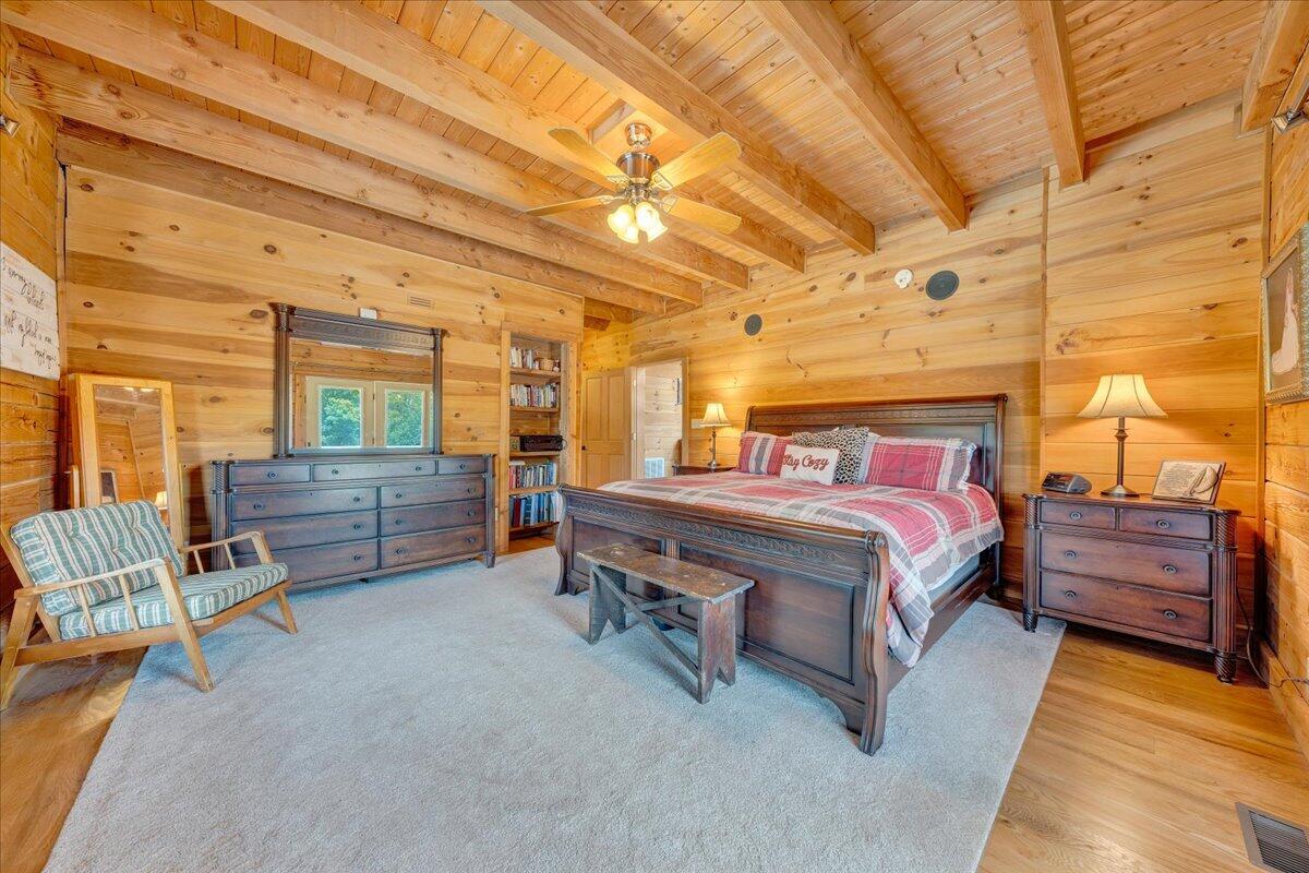 1769 Scenic View Road Moneta, VA 24121 - Photo 33 of 104 a bedroom with a bed and wooden floor