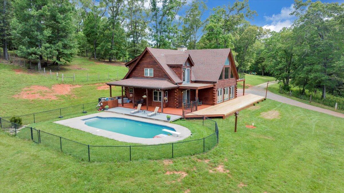1769 Scenic View Road Moneta, VA 24121 - Photo 5 of 104 an aerial view of a house with swimming pool patio and lake view