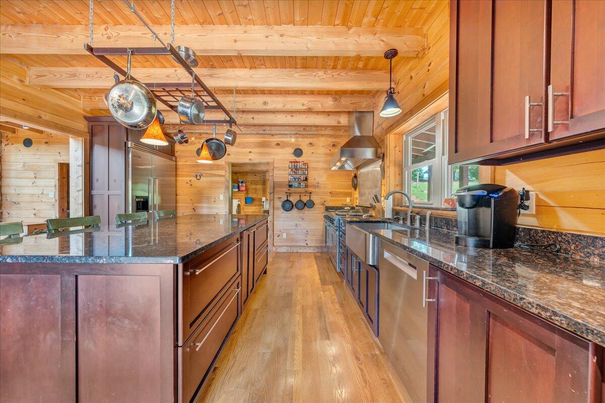 1769 Scenic View Road Moneta, VA 24121 - Photo 6 of 104 a view of a kitchen with stainless steel appliances granite countertop lots of counter top space and wooden floor
