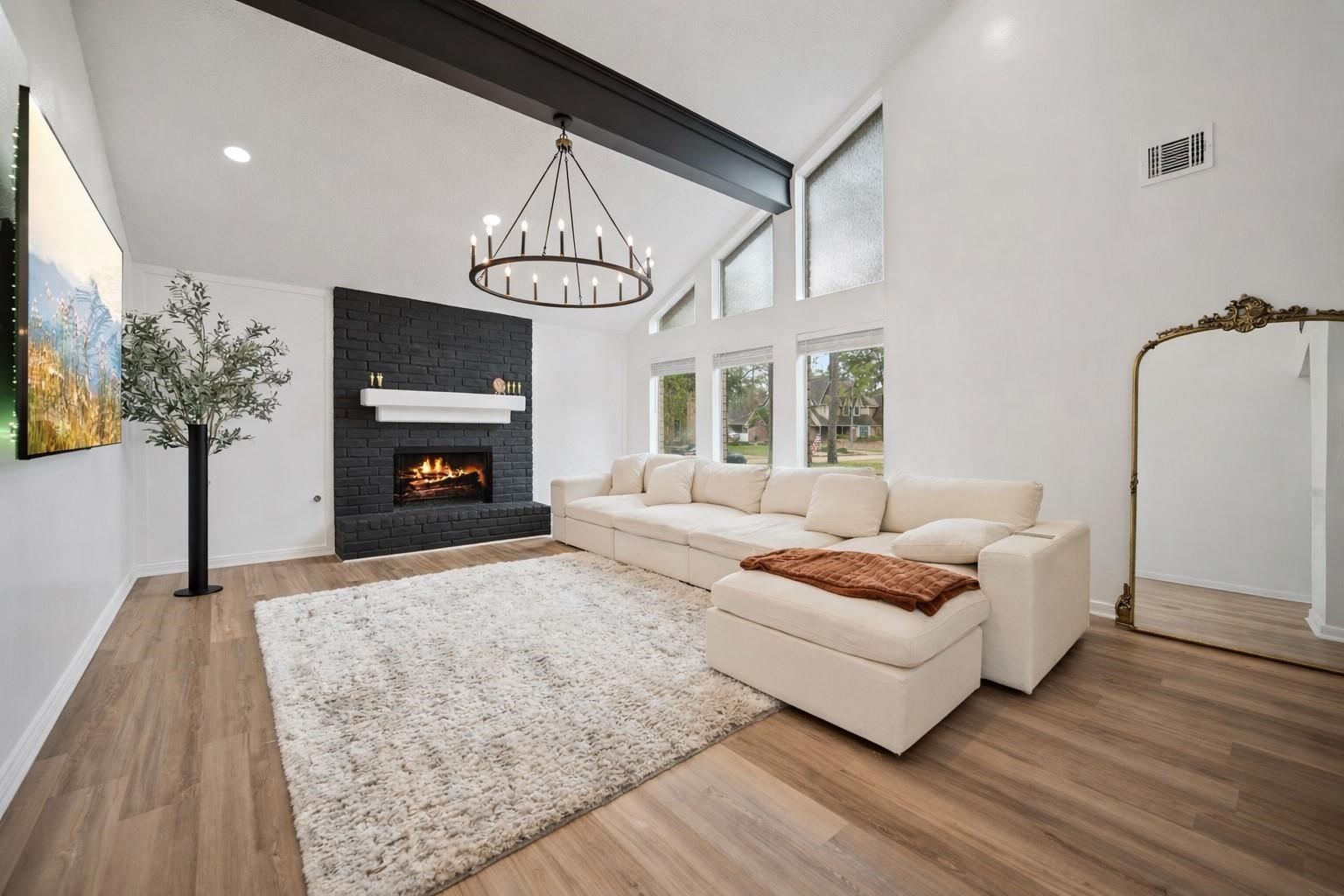 14907 Oak Bluff Court Houston, TX 77070 - Photo 2 of 19 Stunning fireplace and open-concept living space.