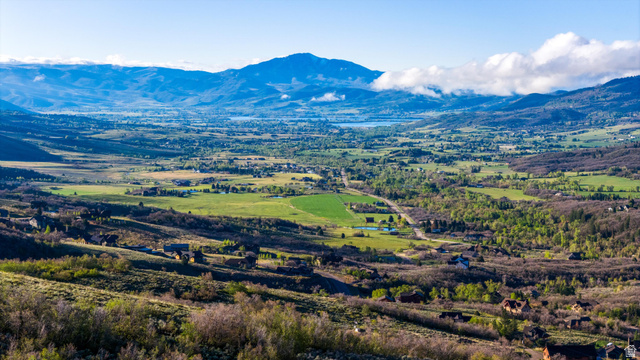 6975 North Durfee Way, Unit 20 Eden, UT 84310 - Photo 15 of 15 Expansive valley with varied terrain, featuring distant mountains, a discernible body of water, and scattered residential properties