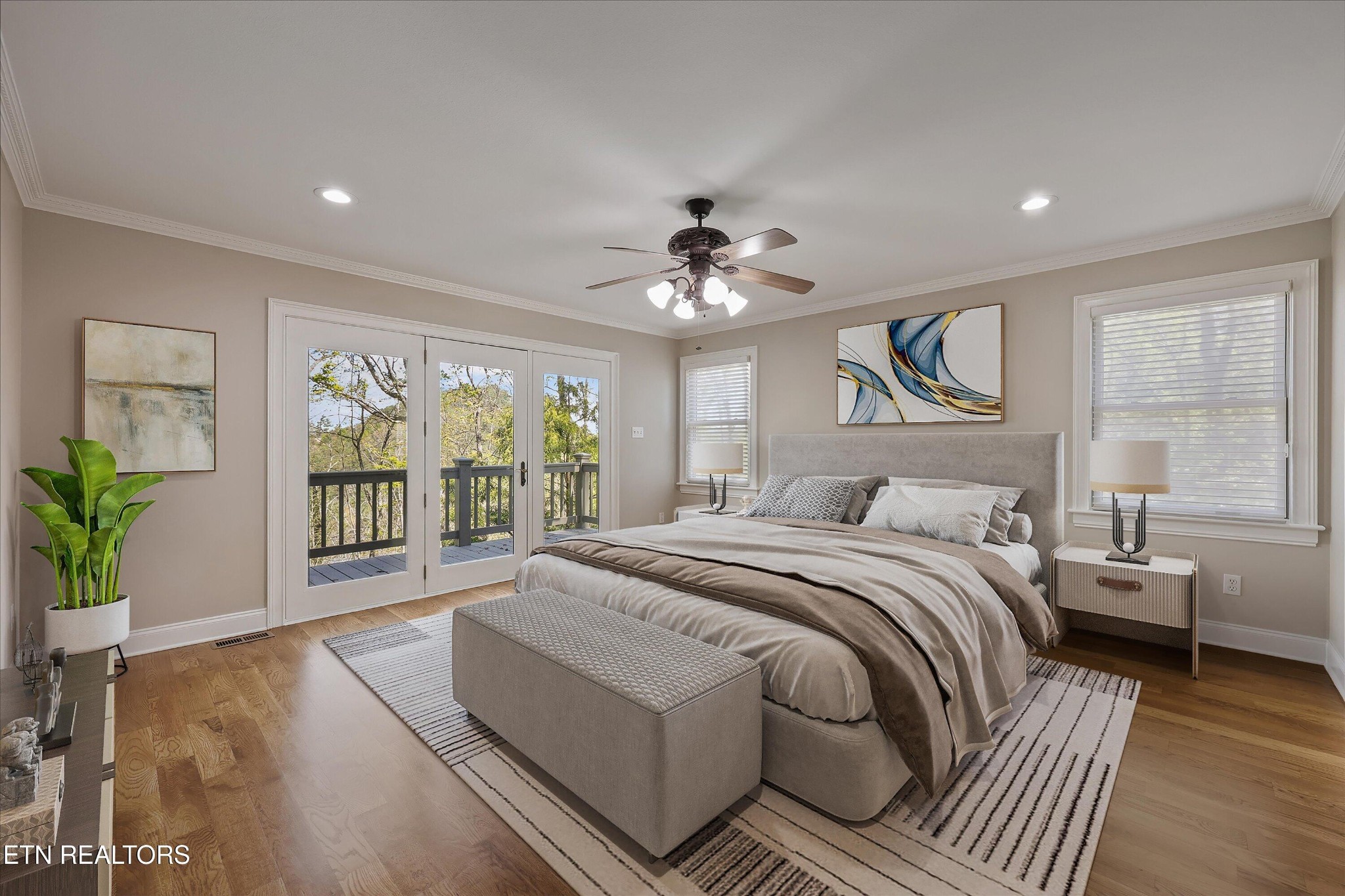 865 Stonegate Way Townsend, TN 37882 - Photo 13 of 60 a spacious bedroom with a large bed and a chandelier