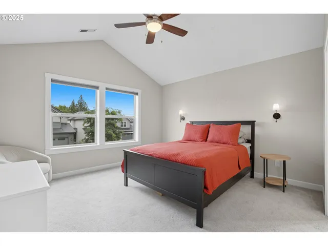 a spacious bedroom with a bed and window