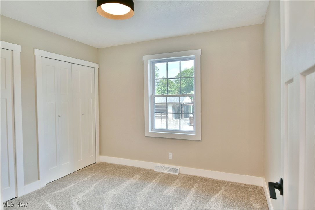 7655 Connelly Road Masury, OH 44438 - Photo 22 of 46 Unfurnished bedroom featuring carpet flooring and baseboards