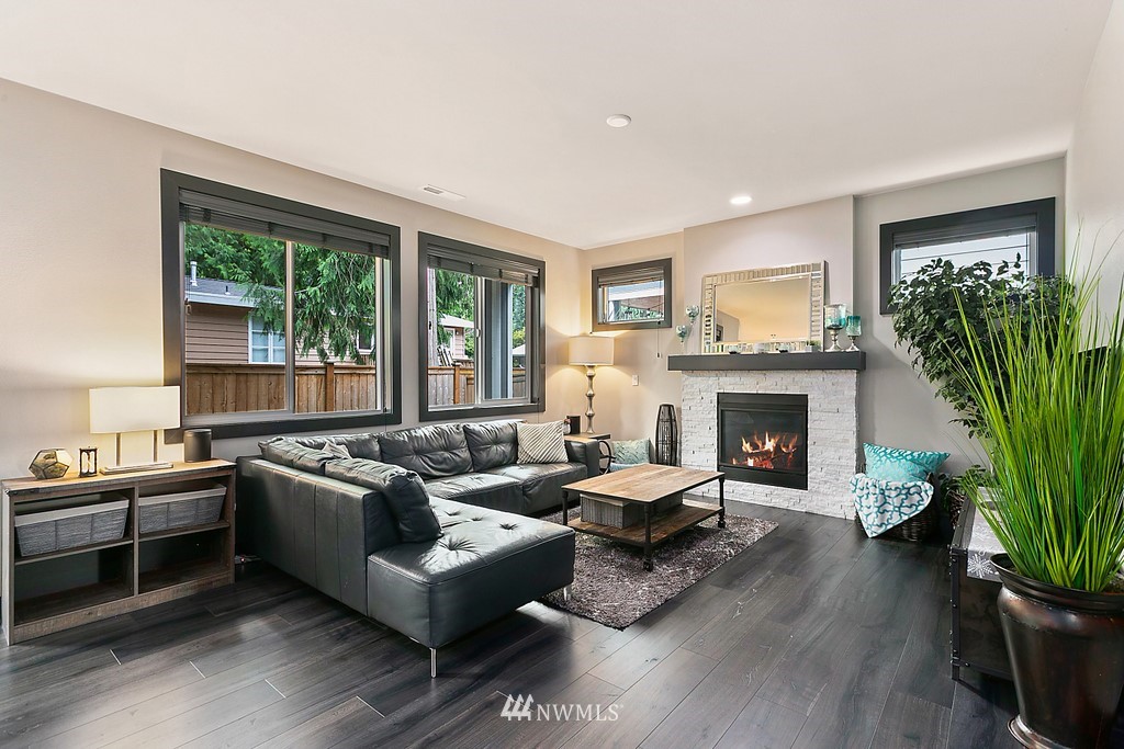 19313 Meridian Drive Southeast Bothell, WA 98012 - Photo 3 of 20 a living room with furniture and a fireplace