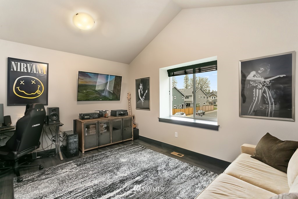 19313 Meridian Drive Southeast Bothell, WA 98012 - Photo 8 of 20 a living room with furniture and a flat screen tv