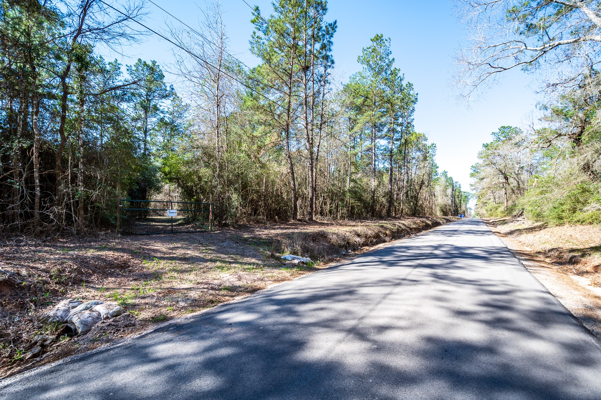 651 Jayhawker Road Cleveland, TX 77328 - Photo 5 of 15 Gated entrance to the property