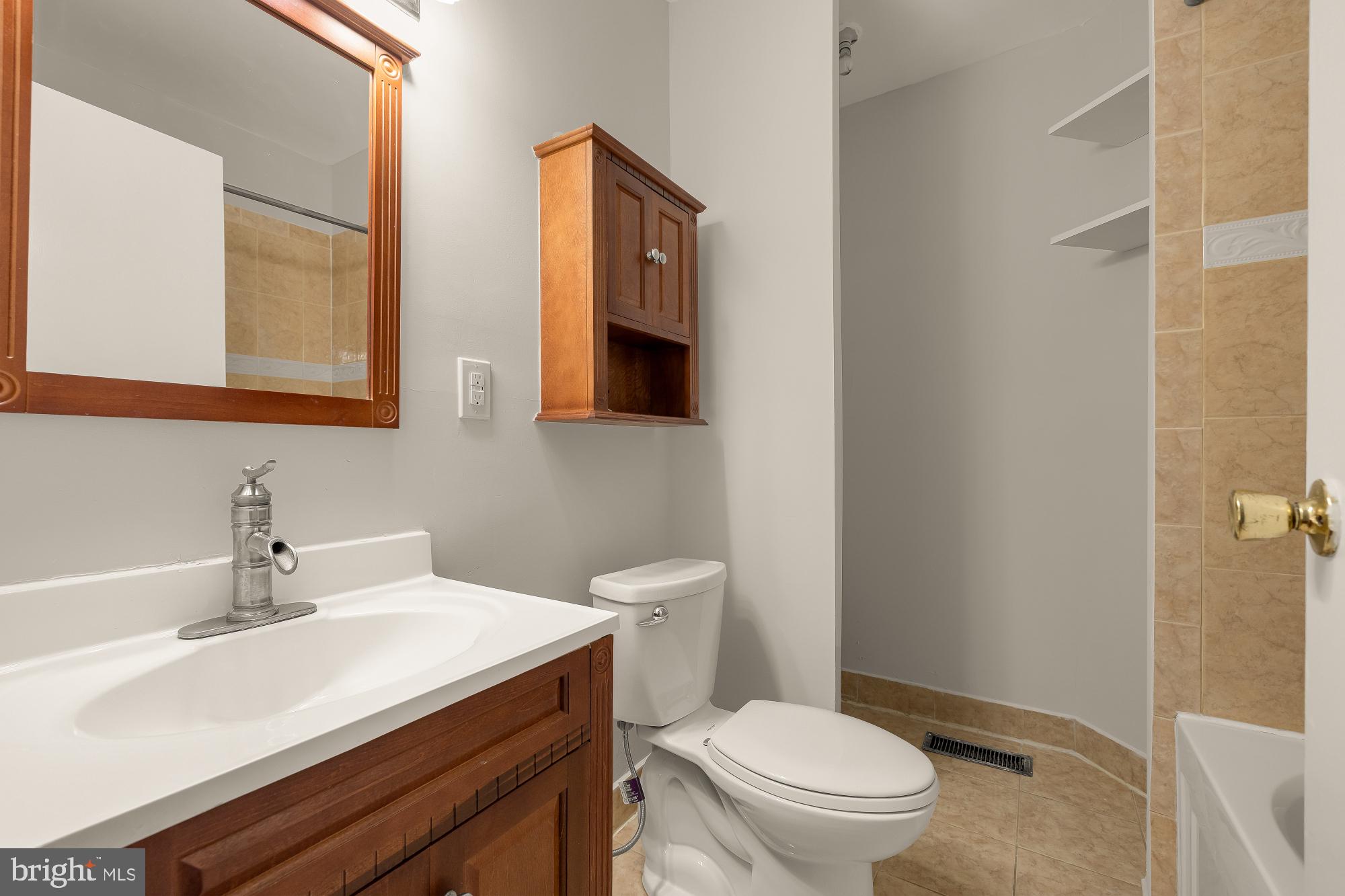 601 L Street Northeast Washington, DC 20002 - Photo 16 of 47 a bathroom with a sink a toilet and mirror
