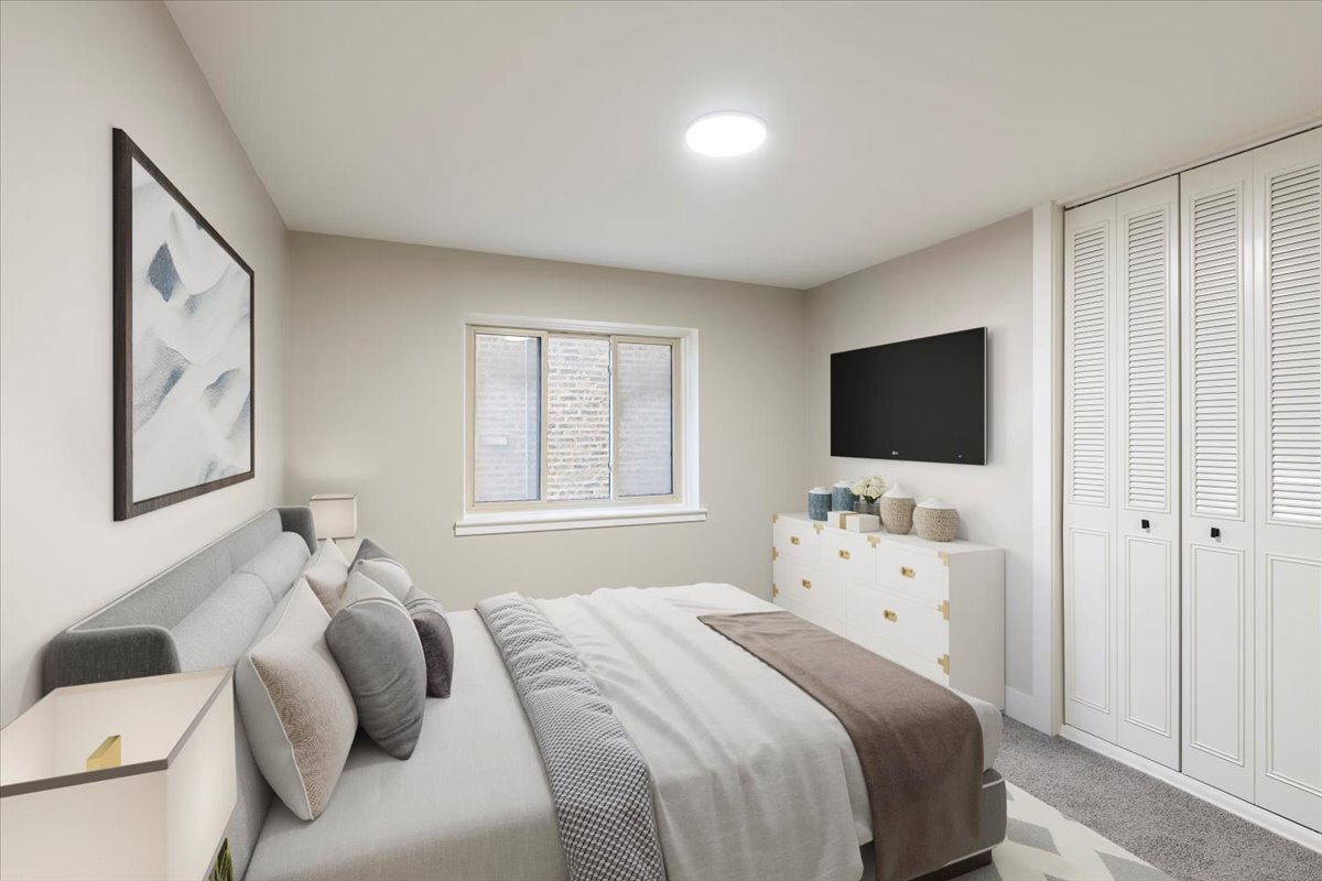 835 Ridge Avenue, Unit 207 Evanston, IL 60202 - Photo 10 of 18 a bedroom with a bed tv and window