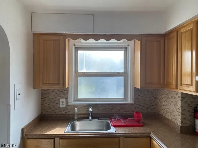 a bathroom with a sink and a window