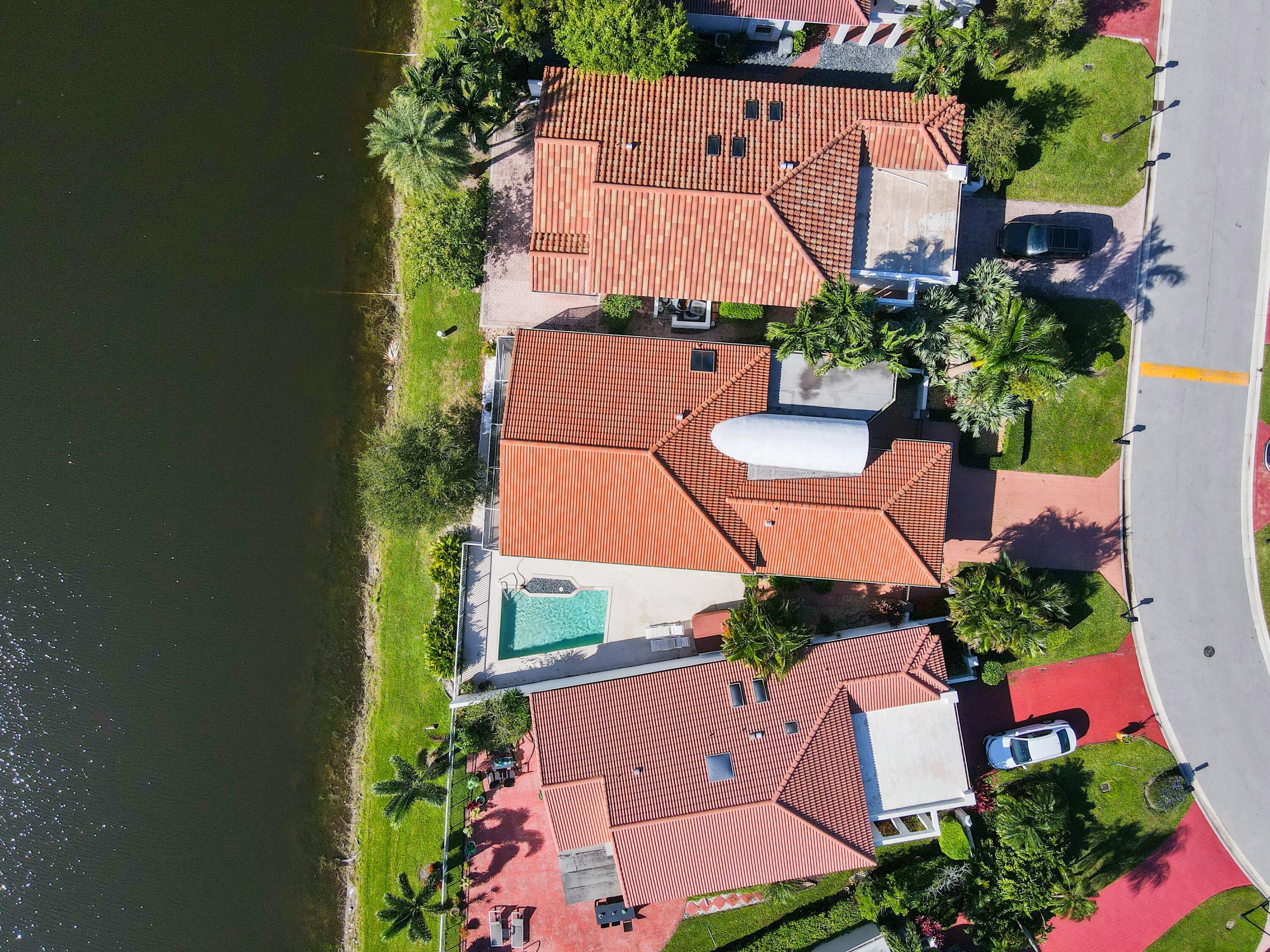 an aerial view of house with yard swimming pool and outdoor seating