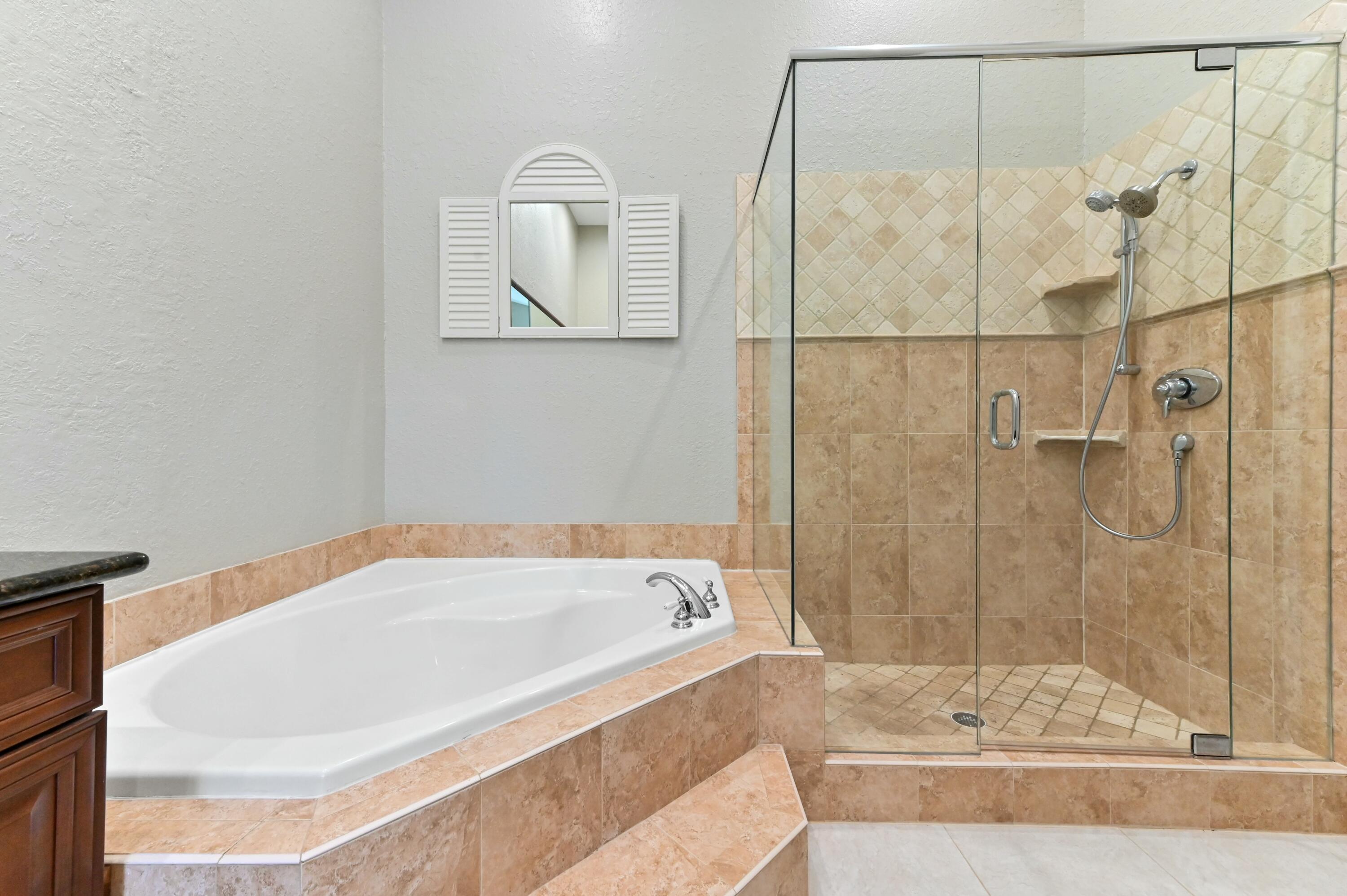 17272 Hampton Boulevard Boca Raton, FL 33496 - Photo 24 of 33 a bathroom with a bathtub and shower