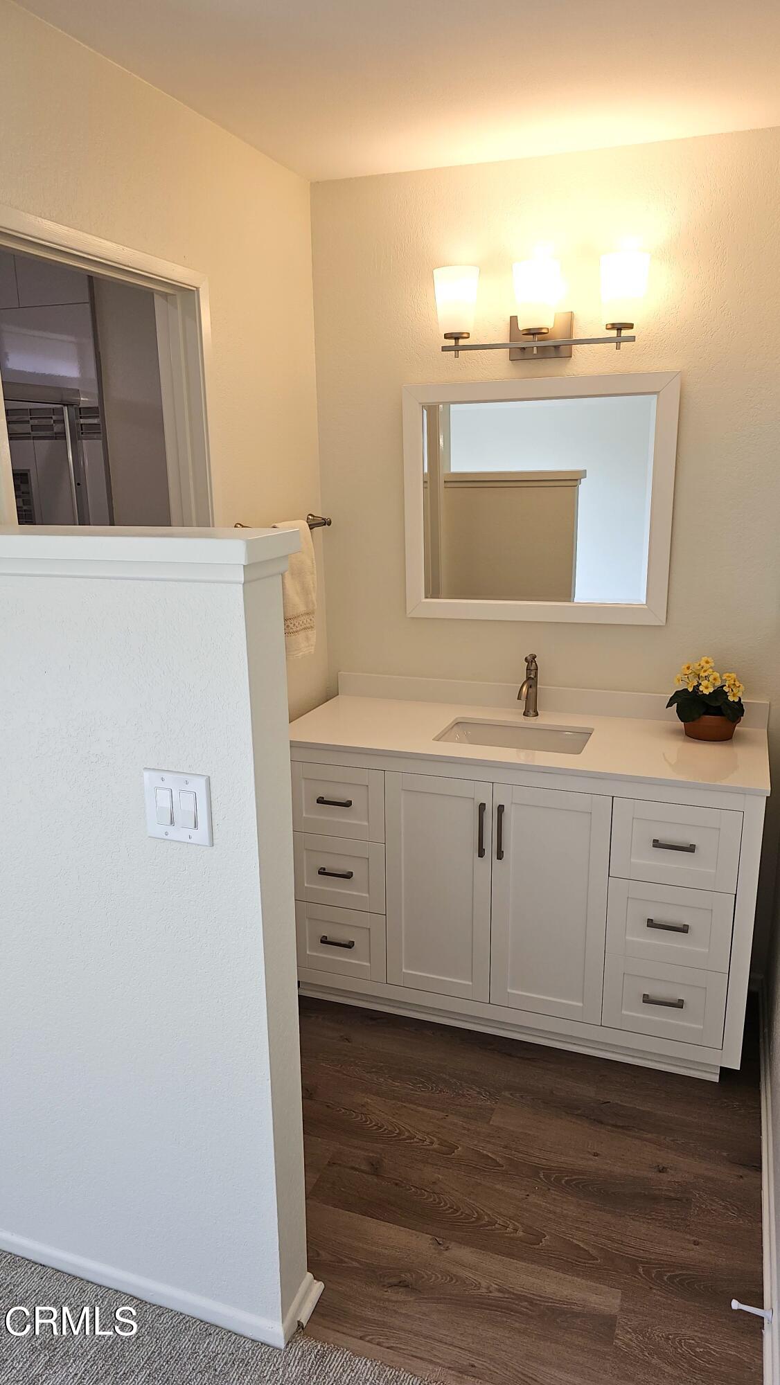Undisclosed Address Oxnard, CA 93036 - Photo 13 of 22 a bathroom with a sink vanity and mirror