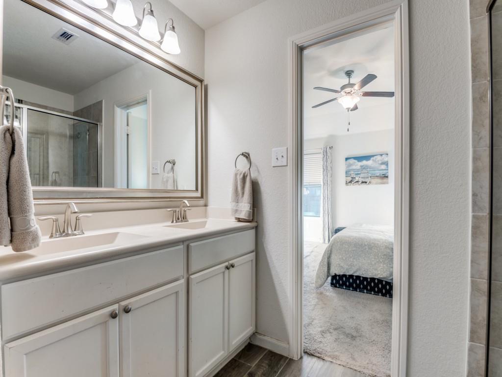 115 Garner Court Forney, TX 75126 - Photo 17 of 26 a en suite bathroom with a sink and mirror