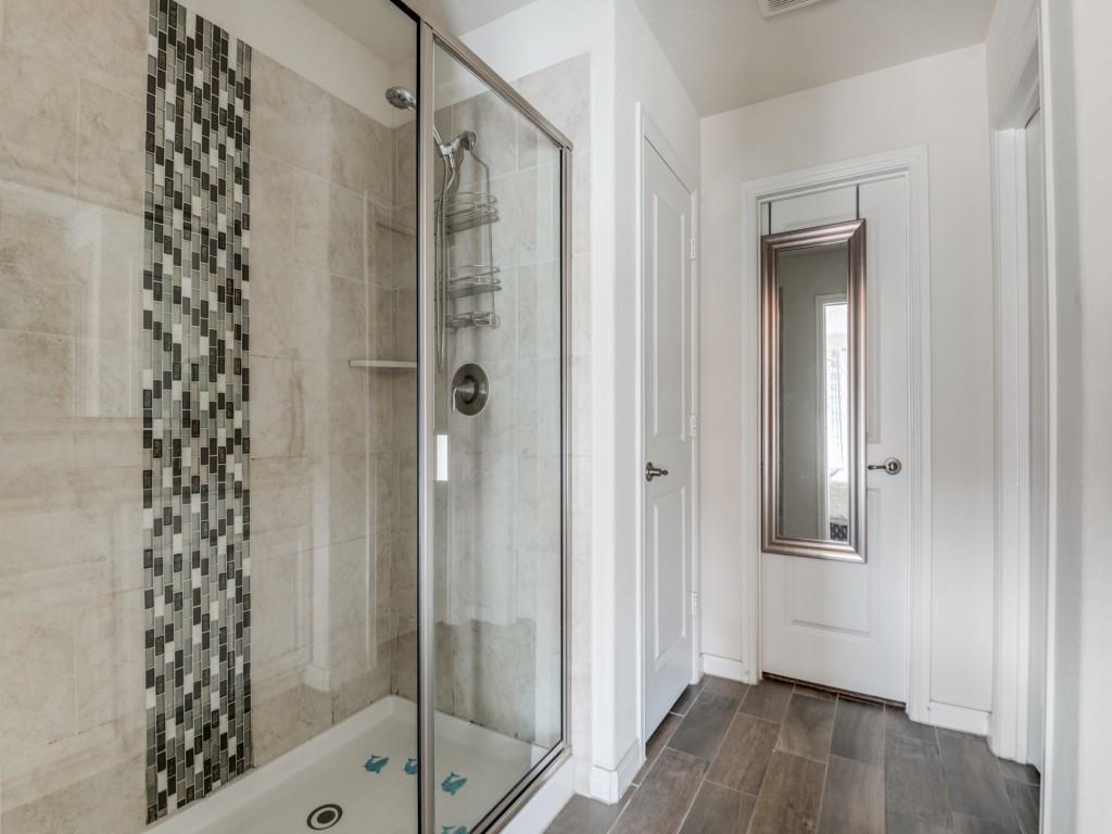 115 Garner Court Forney, TX 75126 - Photo 18 of 26 a bathroom with a shower